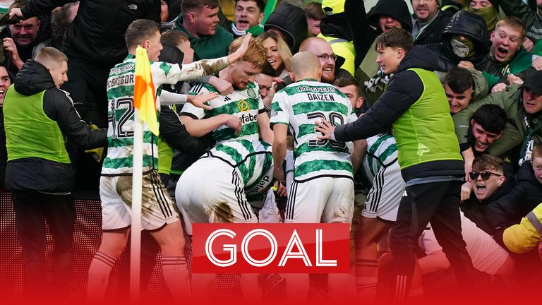 Celtic's Paulo Bernardo (on floor) celebrates with team-mates 