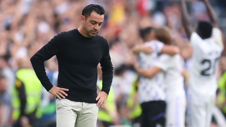 Head coach Xavi Hernandez of FC Barcelona looks on dejected during the LaLiga Santander match between Real Madrid CF and FC Barcelona at Estadio Santiago Bernabeu on October 16, 2022 in Madrid, Spain.