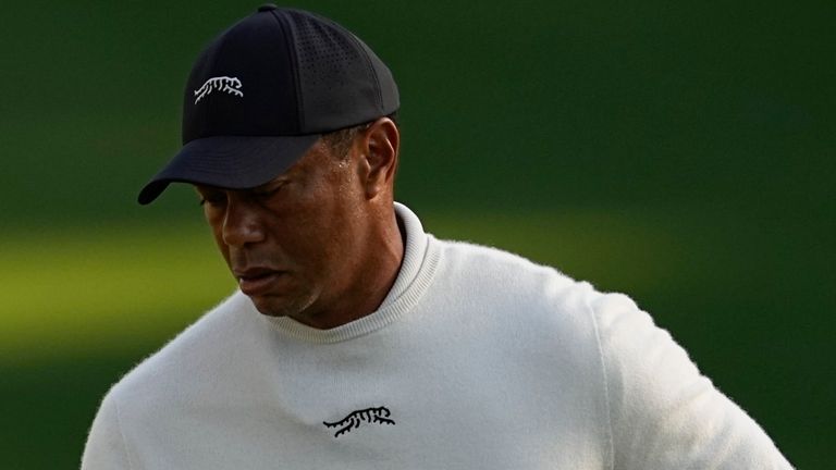 Tiger Woods looks at his putter on the 10th hole during a practice round in preparation for the Masters golf tournament at Augusta National Golf Club Monday, April 8, 2024, in Augusta, Ga. (AP Photo/George Walker IV)