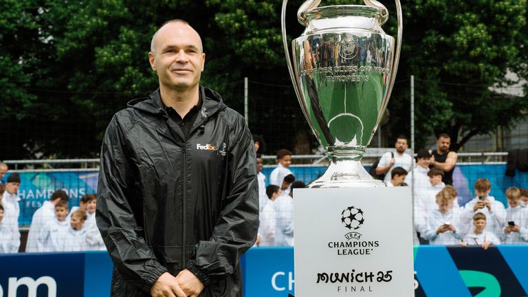 Andres Iniesta delivers the Champions League trophy to Munich in 2025 (Credit: FedEx)