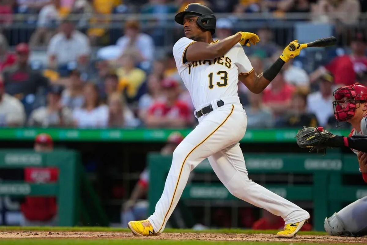 May 13, 2022; Pittsburgh, Pennsylvania, USA; Pittsburgh Pirates third baseman Ke Bryan Hayes (13) hits an RBI double against the Cincinnati Reds during the third inning at PNC Park. Mandatory Credit: Gregory Fisher-Imagn Images