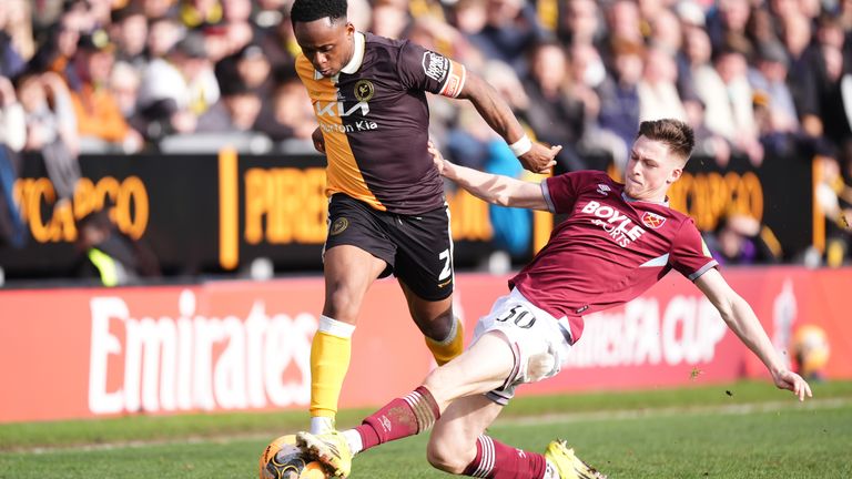 Burton Albion's Udoka Godwin-Malife is tackled by West Ham's Oliver Scarles 
