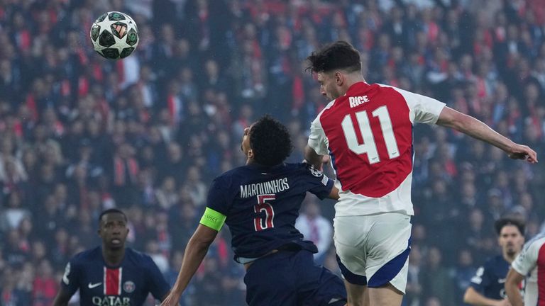 Arsenal's Declan Rice, right, heads the ball past PSG's Marquinhos during the Champions League semifinal, second leg soccer match between Paris Saint-Germain and Arsenal at the Parc des Princes in Paris, Wednesday, May 7, 2025. (AP Photo/Thibault Camus)