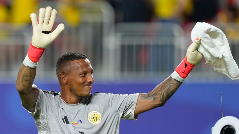 Curacao goalkeeper Eloy Room waves after his team's draw against Ecuador in a World Cup Group E 